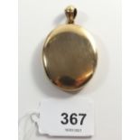 A large Victorian oval gold plated locket, 4.5 x 3.5cm