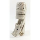 An Inuit carved bone tupilak (bad luck charm), 13cm from Sisimiut