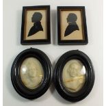 A pair of 19th century oval wax portraits (one cracked) in ebony frames, 13.5 x 11cm and two