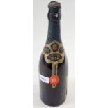 A vintage bottle of Veuve a Devaux Epernay Black Neck 1936 champagne, with original deposit label on