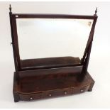 A Georgian mahogany large toiletry swing mirror on three drawer base, all with satinwood