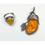 An 875 continental silver and amber ring and an amber pendant, a/f