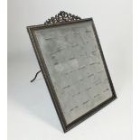 A mid 20thC jewellers ring display framed panel, 27cm by 20cm