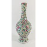 A 19th century Chinese famille rose porcelain vase decorated with flowers, 24.5cm, a/f