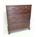A Georgian mahogany chest of two short and four long drawers with ivory esutcheons, all on tall