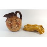 A Royal Doutlon John Barleycorn jug and a Rene Combeau glove form novelty ashtray