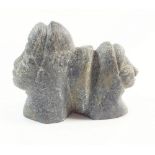 An Inuit carved black stone two headed group, 5 x 7cm