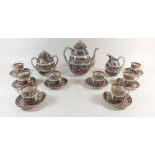 A Canton tea service comprising eight cups and saucers, teapot, jug and sugar