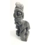 A Greenland Inuit carved black stone grotesque figure from Paamiut, 16cm