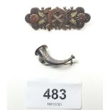 A Victorian silver horse shoe and riding motif brooch inset coloured gold, Birmingham 1892 and a