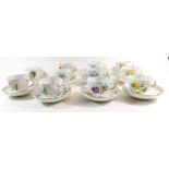 A 20th century Meissen tea service comprising eleven cups and saucers painted sprays and posies of
