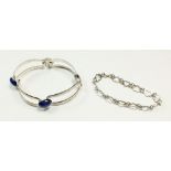 A silver and lapis lazuli bracelet together with a silver heart bracelet