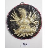 A 19thC continental cast metal painted plaque of an Imperial eagle, 16cm diameter