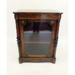 A Victorian walnut pier cabinet with marquetry frieze and single glazed door flanked by pilastas,