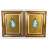 A pair of late Victorian Wedgwood Jasperware green oval plaques of muses, framed and glazed,