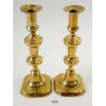 A pair of 19th century brass candlesticks