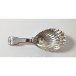 A silver caddy spoon with shell bowl and fiddle pattern handle, London 1812, by Josiah Snatt