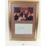 A framed photograph of The Beatles and Brian Epstein taken in London in 1964 and an autograph for