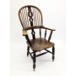 A 19th century Windsor chair with turned supports