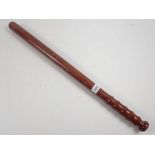 A long wooden truncheon, possibly a riot truncheon 66cm