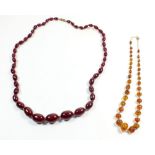 A Bakelite amber necklace and an amber necklace