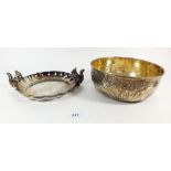A silver plated bowl with embossed floral decoration and a silver plated nut bowl with squirrel