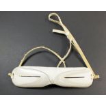 A pair of Greenland Inuit carved bone snow goggles from Qaanaaq