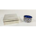 A silver cigarette box, London 1901 and a silver salt with blue glass liner
