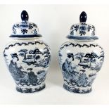 A pair of Chinese blue and white vases and covers, painted figures and landscapes, 38cm