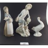 A Lladro figure boy with dog and girl with pig plus a goose figure