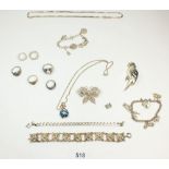 A group of silver jewellery including parrot brooch, charm bracelet etc