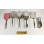 A four piece silver dressing table set, Birmingham 1937, two further silver backed brushes etc