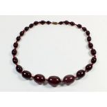 A cherry amber necklace, 31g