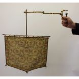 An early Victorian gilt metal clamp on embroidered fire screen