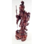 A carved wood Chinese figure of a fisherman, 33cm