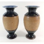 A pair of Royal Doulton stoneware vases, 20cm, one chipped