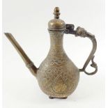 A cast brass Eastern ewer with engraved decoration, 27cm