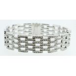 A fine 18ct white gold diamond set modern articulated link bracelet, 70g, 18cm (total 7.35cts