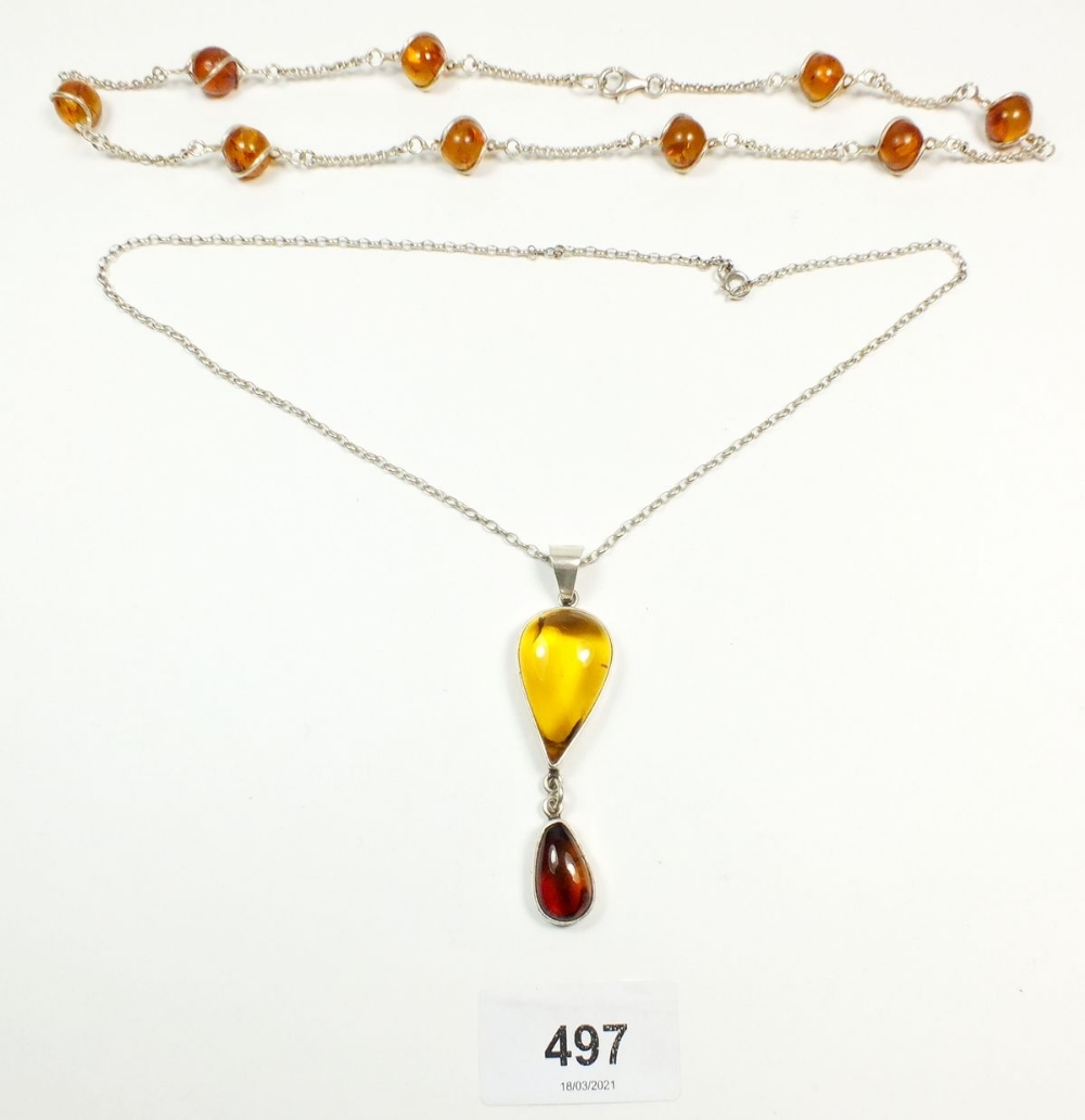 Two silver and amber necklaces