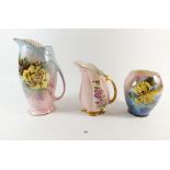 Two Royal Winton floral painted jugs and a vase, tallest 25cm