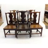 A matched set of six oak Georgian country chairs with vase backs and solid seats, all on square