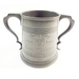 Rowing interest - A late 19thC pewter two handled jug decorated with Queens College of Oxford