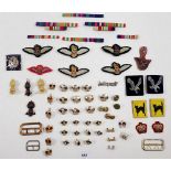 A box of assorted military badges and buttons