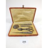 A French silver plated six piece needlework set boxed