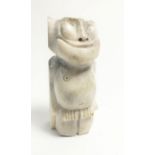 A Russian Inuit carved bone Billiken, 6cm from Uelen