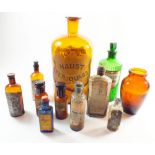 A box of collectable glass chemists bottles