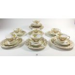 An Atlas china tea service comprising: six cups and saucers, twelve tea plates, cake plate and sugar