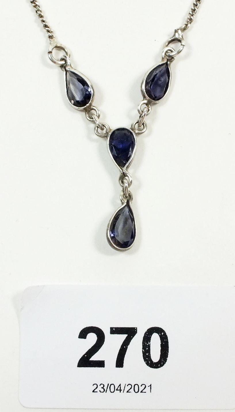 A silver and pear drop tanzanite necklace
