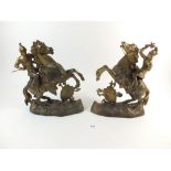 A pair of gilt spelter figures of horsemen - 26cm high