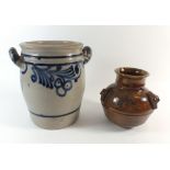 A stoneware pottery vase with oriental motifs, signed CM, 15cm tall and a grey stoneware jar